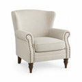 Sillón de lino beige con estructura de madera y patas marrones